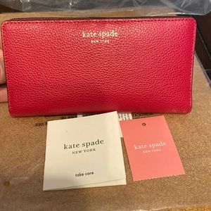 Like new red Kate Spade large slim bifold wallet